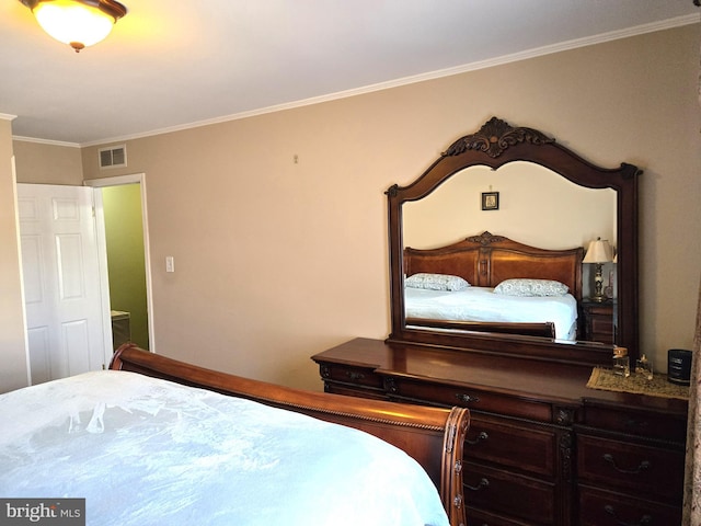 bedroom featuring visible vents and crown molding