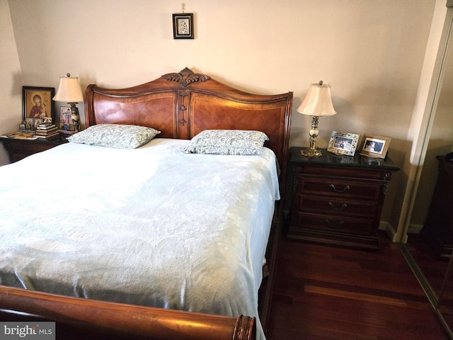 bedroom featuring wood finished floors