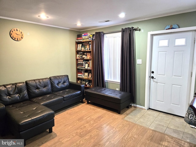 living area featuring crown molding, recessed lighting, visible vents, and light wood-type flooring