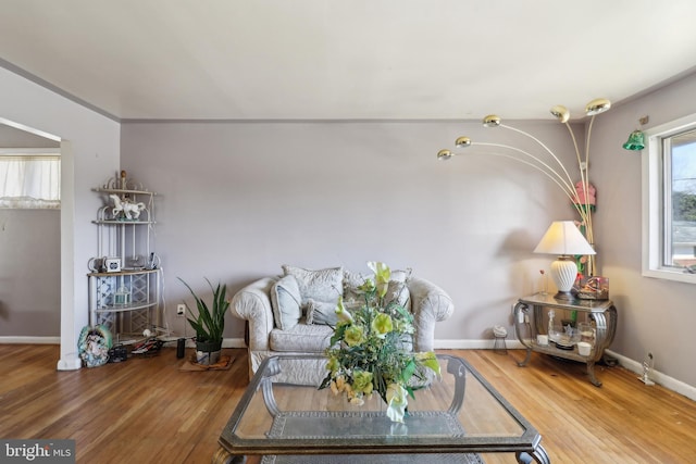 sitting room with wood finished floors and baseboards