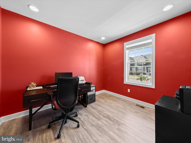 office area with recessed lighting, visible vents, baseboards, and wood finished floors