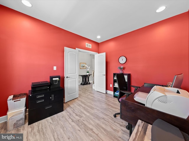 office featuring visible vents, recessed lighting, baseboards, and wood finished floors