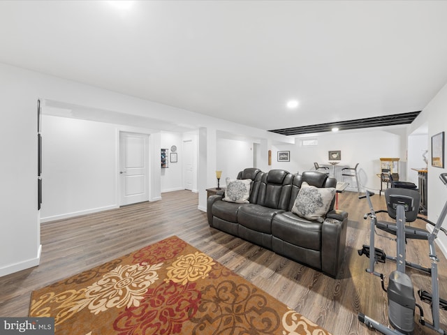 living area with wood finished floors and baseboards