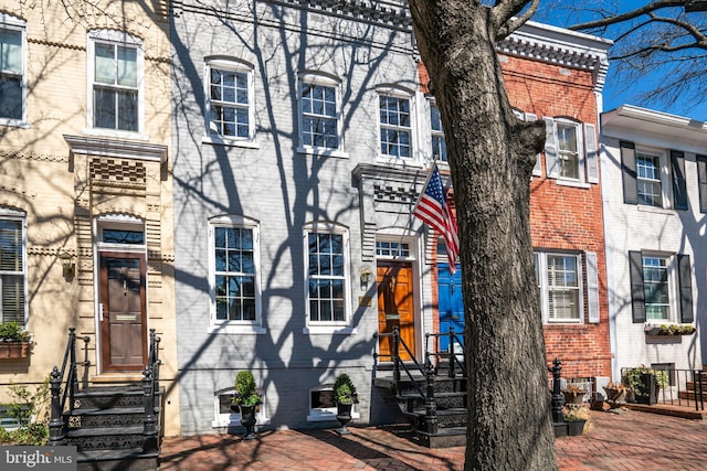 townhome / multi-family property with brick siding