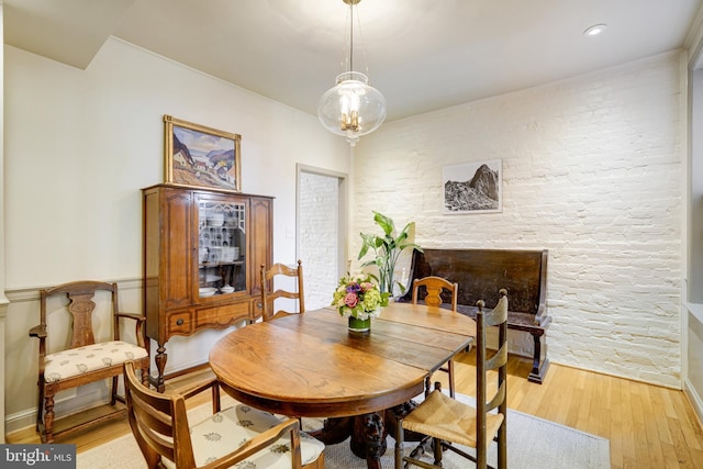 dining space with light wood-type flooring