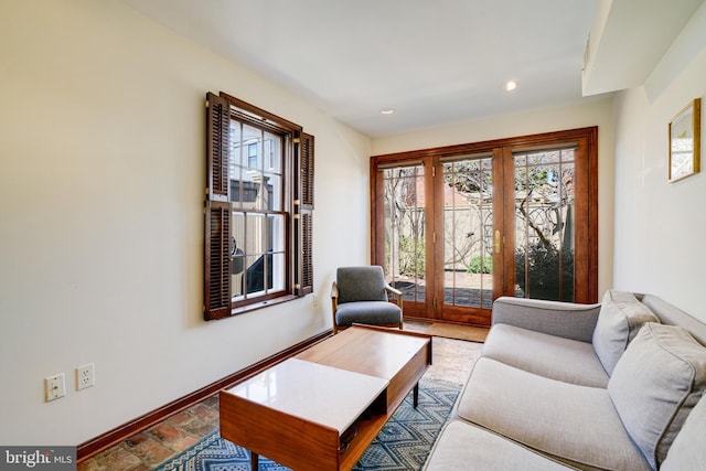 living room featuring recessed lighting, french doors, and baseboards