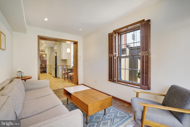 living room featuring recessed lighting and light wood finished floors