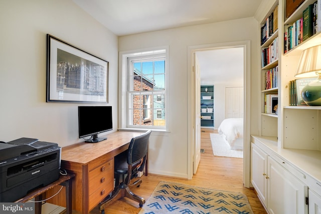 home office featuring light wood finished floors