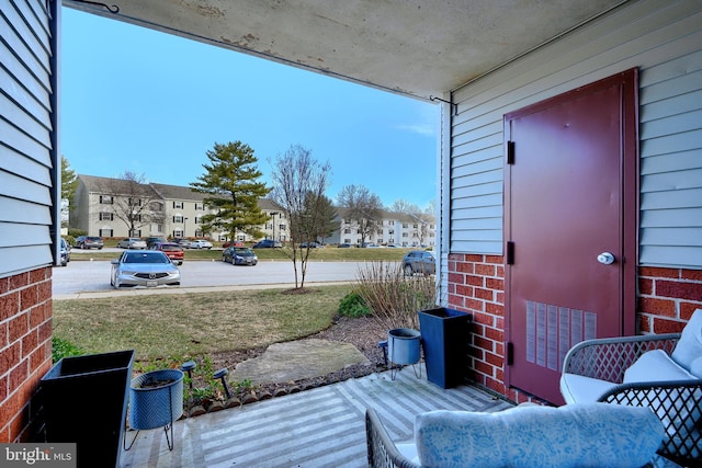 wooden deck with a residential view