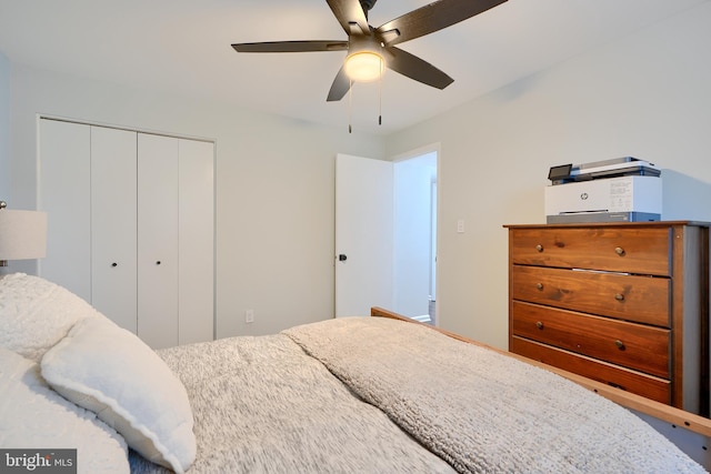 bedroom featuring a closet and a ceiling fan