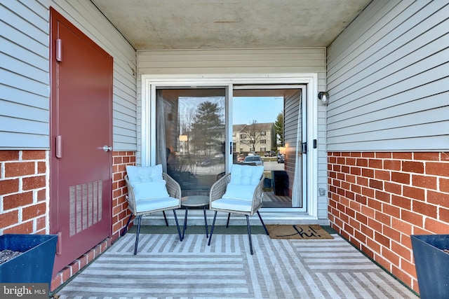 wooden terrace featuring visible vents