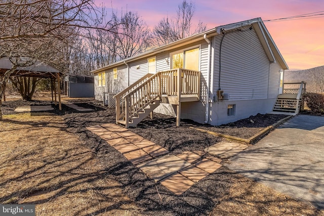 view of front of property with a storage unit and an outdoor structure