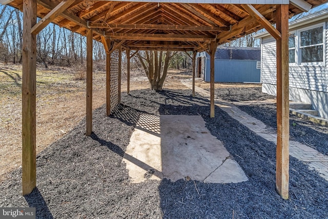 view of patio featuring an outdoor structure