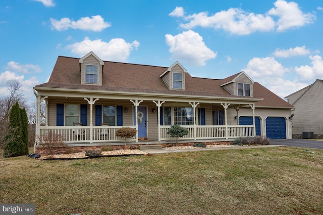 view of front of property with a porch, central AC unit, a front lawn, and driveway