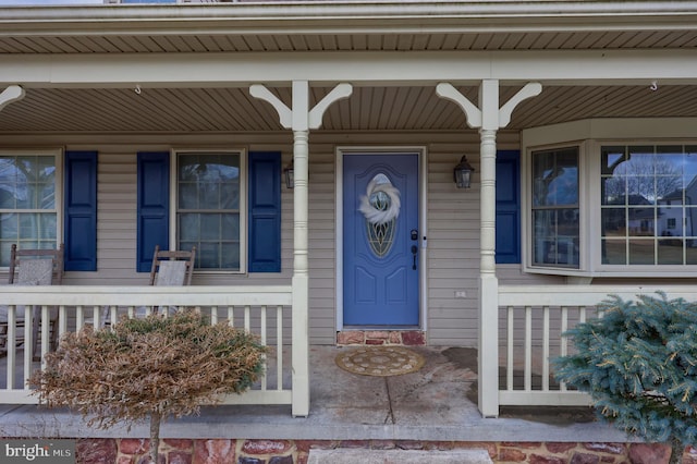 doorway to property featuring a porch