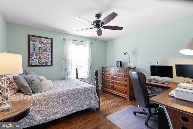 bedroom featuring a ceiling fan and dark wood-style flooring