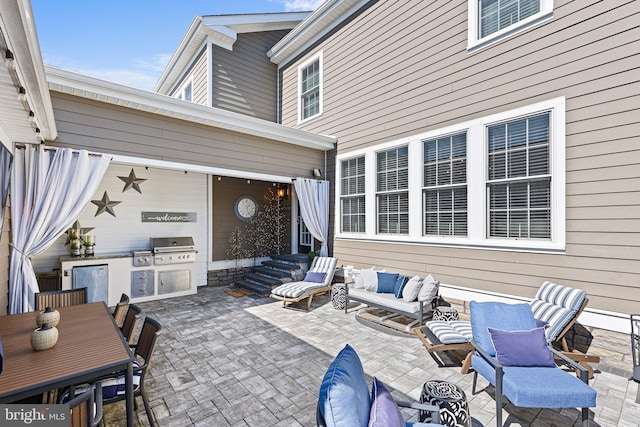 view of patio / terrace featuring an outdoor kitchen, entry steps, outdoor lounge area, and a grill