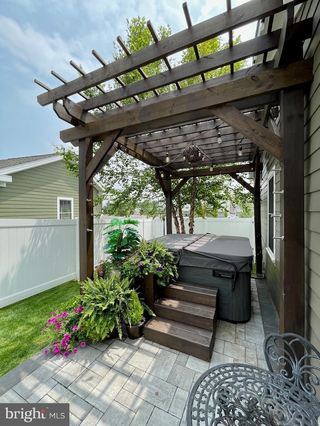 view of patio featuring a fenced backyard, a pergola, and a hot tub