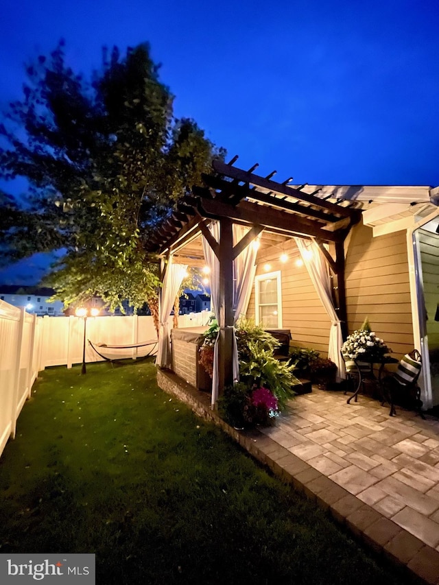 exterior space with a patio, a fenced backyard, and a pergola