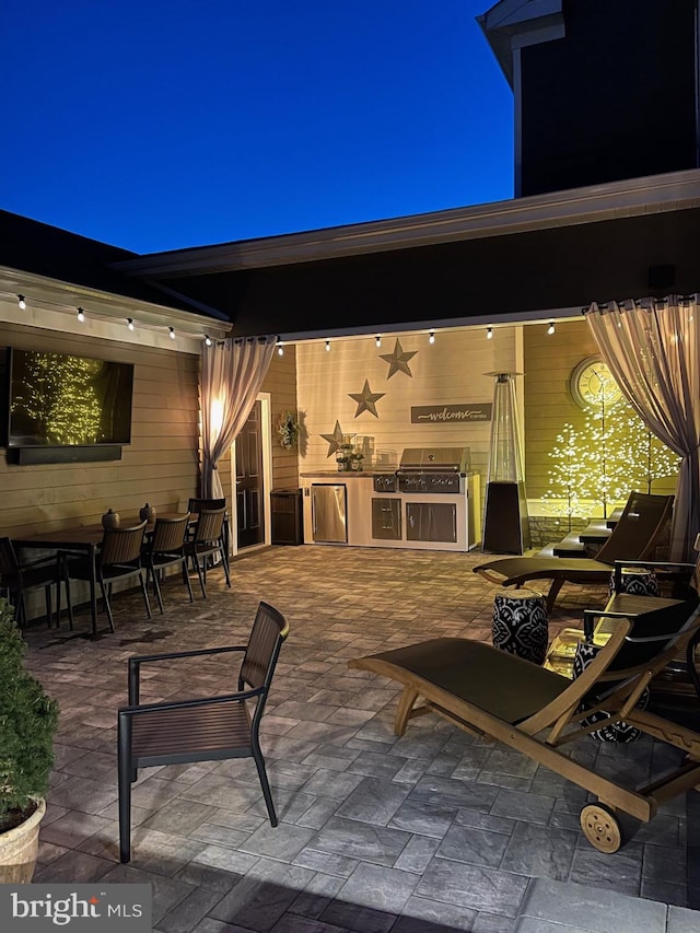 view of patio featuring area for grilling and an outdoor kitchen