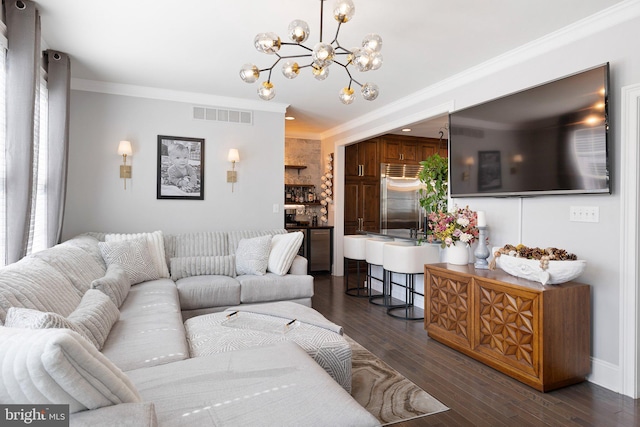 living room with baseboards, visible vents, dark wood-style flooring, ornamental molding, and a notable chandelier