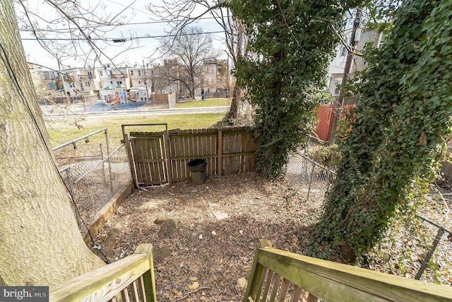 view of yard with a residential view and fence