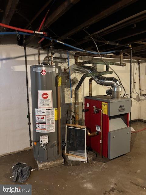 utility room with water heater