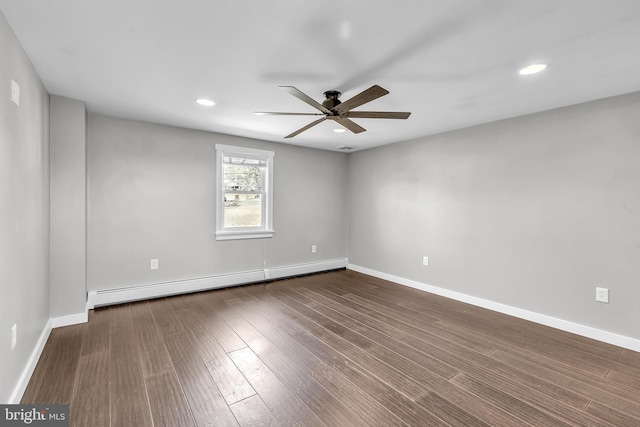 spare room with a ceiling fan, dark wood-style floors, recessed lighting, baseboards, and baseboard heating