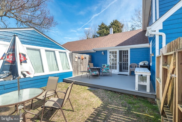 view of patio / terrace with a wooden deck and fence