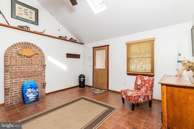 sitting room featuring tile patterned floors, a skylight, baseboards, and high vaulted ceiling