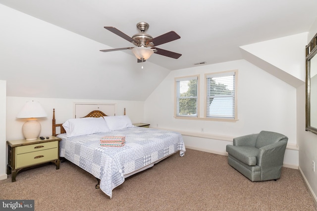 bedroom with visible vents, ceiling fan, baseboards, vaulted ceiling, and light carpet