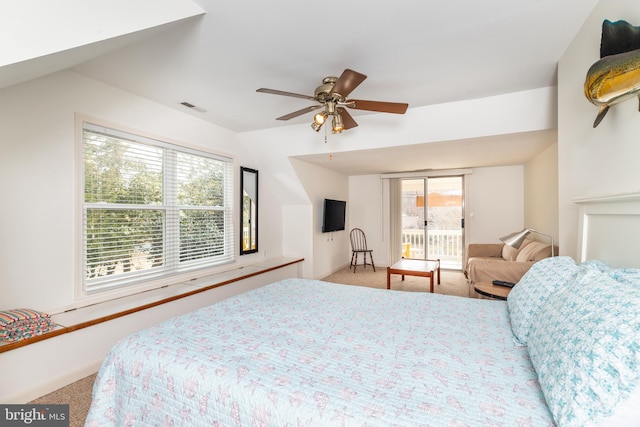 bedroom with access to exterior, visible vents, baseboards, carpet flooring, and a ceiling fan