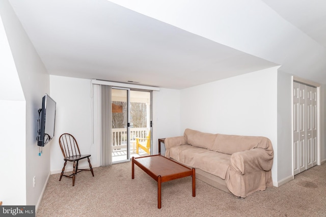 living room with baseboards and carpet