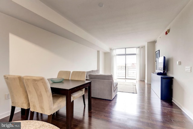 dining area with floor to ceiling windows, dark wood-type flooring, and baseboards