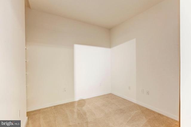 unfurnished room featuring baseboards and carpet floors