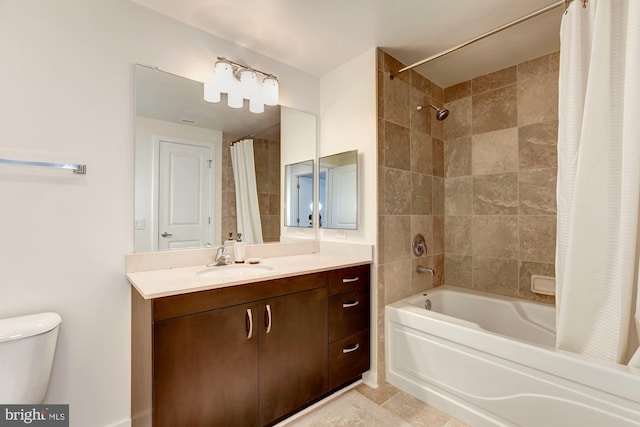 full bathroom featuring toilet, shower / bath combo, and vanity