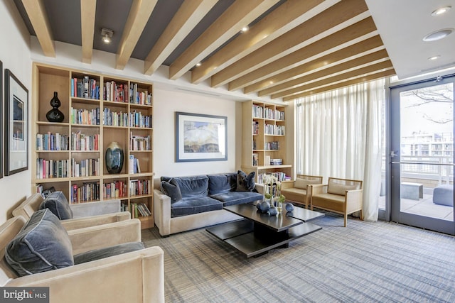 sitting room with beam ceiling, recessed lighting, and carpet floors