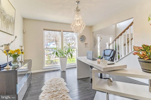 office area with dark wood-type flooring, a healthy amount of sunlight, baseboards, and a chandelier