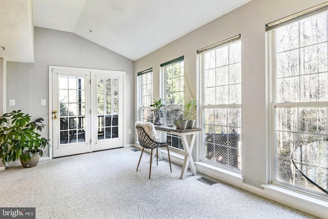 office featuring carpet flooring, baseboards, visible vents, and vaulted ceiling