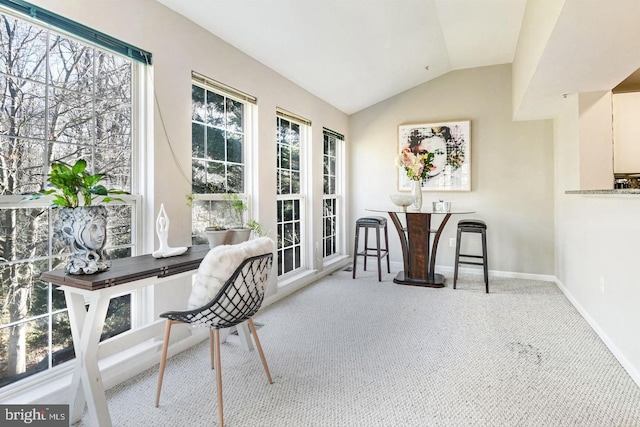 carpeted office with baseboards and lofted ceiling