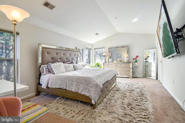 bedroom with visible vents, lofted ceiling, light colored carpet, and baseboards