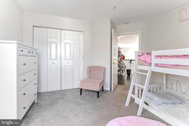 carpeted bedroom with a closet