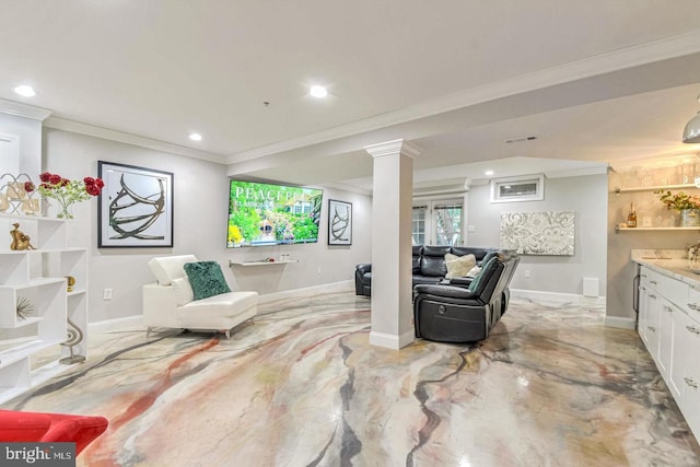 living area with visible vents, baseboards, and decorative columns