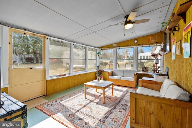 sunroom / solarium featuring ceiling fan and vaulted ceiling