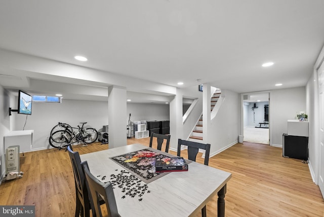 dining space with stairs, light wood-style flooring, recessed lighting, and baseboards