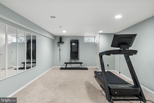 exercise area featuring recessed lighting, baseboards, and carpet floors