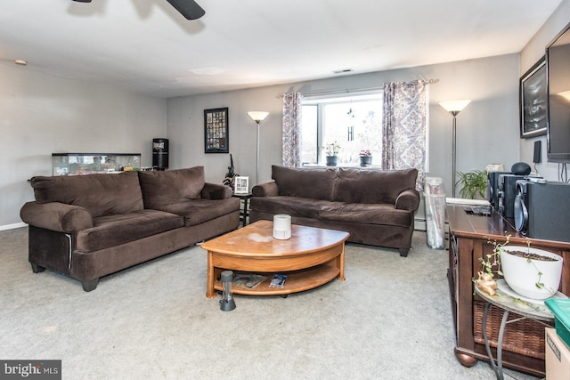 carpeted living area with visible vents and baseboards