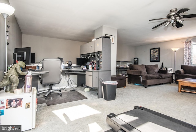 office space with light colored carpet and ceiling fan