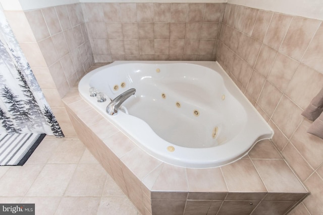 bathroom featuring tile patterned flooring and a jetted tub