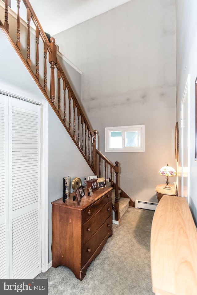 interior space featuring carpet floors and a baseboard radiator